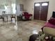 Inviting living room featuring neutral tones, tile floors and an open floor plan at 1320 Norman Ave, Las Vegas, NV 89104