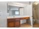 Bathroom vanity featuring drawers and an extra long counter with a mirror at 1701 E Katie Ave # 36, Las Vegas, NV 89119