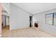Open concept living room boasting neutral walls, tile flooring, and a cozy fireplace, perfect for relaxing and entertaining at 1701 E Katie Ave # 36, Las Vegas, NV 89119