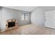 Light and airy living room featuring tile floors, neutral walls, and a cozy fireplace, offering a comfortable and versatile space at 1701 E Katie Ave # 36, Las Vegas, NV 89119