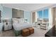 Bright main bedroom with sitting area, city views, plush seating, and ensuite bathroom at 2000 Fashion Show Dr # 6109, Las Vegas, NV 89109