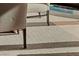 Close-up of a textured carpet and chair legs, showcasing the soft and durable flooring at 2000 Fashion Show Dr # 6109, Las Vegas, NV 89109