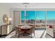 Elegant dining area with seating for four, showcasing a stunning cityscape view and designer lighting at 2000 Fashion Show Dr # 6109, Las Vegas, NV 89109