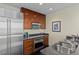 Modern kitchen with stainless steel appliances and dark wood cabinets and light countertops at 2000 Fashion Show Dr # 6109, Las Vegas, NV 89109