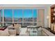 Living area with comfortable seating, large windows overlooking the city and custom built-in cabinetry at 2000 Fashion Show Dr # 6109, Las Vegas, NV 89109