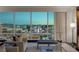 Elegant living room with floor-to-ceiling windows, showcasing a breathtaking city view, stylish furnishings, and chic decor at 2000 Fashion Show Dr # 6109, Las Vegas, NV 89109