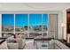 Elegant living room featuring floor-to-ceiling windows with stunning city views, plush seating, and stylish decor at 2000 Fashion Show Dr # 6109, Las Vegas, NV 89109