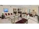 Large living room with comfortable seating, bar area, and floor to ceiling windows overlooking the city at 2000 Fashion Show Dr # 6109, Las Vegas, NV 89109