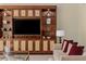 Bright living room with custom entertainment center and shelving for displaying decorative items at 2000 Fashion Show Dr # 6109, Las Vegas, NV 89109