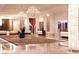 Elegant lobby featuring chandeliers, marble floors, decorative columns and tables topped with flower arrangements at 2000 Fashion Show Dr # 6109, Las Vegas, NV 89109