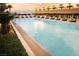 Inviting pool with lounge chairs and umbrellas with palm trees and views in the background at 2000 Fashion Show Dr # 6109, Las Vegas, NV 89109