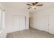 Bedroom featuring wood-look floors, ceiling fan, closet and natural light from the window at 2128 La Salle St, Las Vegas, NV 89106