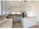 Kitchen features mosaic backsplash, breakfast bar, stainless steel appliances, and light blue cabinets at 2128 La Salle St, Las Vegas, NV 89106