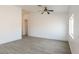Spacious living room with wood-look floors, archway, and large window offering plenty of light at 2128 La Salle St, Las Vegas, NV 89106