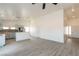 Open-concept living room and kitchen with breakfast bar, recessed lighting, and wood-look floors at 2128 La Salle St, Las Vegas, NV 89106