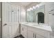 Modern bathroom features double sink vanity and a large framed mirror with decorative lighting at 2200 S Fort Apache Rd # 2153, Las Vegas, NV 89117
