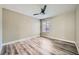 Bedroom with wood-look flooring and ceiling fan; window offers natural light at 2200 S Fort Apache Rd # 2153, Las Vegas, NV 89117