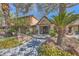 Community clubhouse with beautiful landscaping and mature palm trees at 2200 S Fort Apache Rd # 2153, Las Vegas, NV 89117