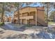 Exterior shot of the condo building with a well-maintained landscape and stairs leading to upper-level units at 2200 S Fort Apache Rd # 2153, Las Vegas, NV 89117