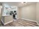 Open kitchen with stainless appliances and breakfast bar flows into dining area with modern lighting at 2200 S Fort Apache Rd # 2153, Las Vegas, NV 89117