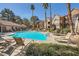 A gorgeous pool surrounded by lounge chairs provides space to relax and unwind at 2200 S Fort Apache Rd # 2153, Las Vegas, NV 89117