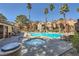 Relaxing spa and community pool highlighted by palm trees and lounge seating at 2200 S Fort Apache Rd # 2153, Las Vegas, NV 89117