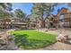 A well maintained artificial turf area next to a picnic area perfect for relaxing at 2200 S Fort Apache Rd # 2153, Las Vegas, NV 89117