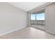 Cozy bedroom with tile floors and sliding glass doors to the outdoor balcony at 222 Karen Ave # 1908, Las Vegas, NV 89109