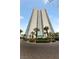 High rise building with manicured landscaping and circular driveway at 222 Karen Ave # 1908, Las Vegas, NV 89109