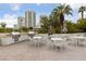 Outdoor grilling area with multiple grills, dining tables, and city views at 222 Karen Ave # 1908, Las Vegas, NV 89109
