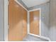 Condo hallway showing unit entrance and utility access with textured wall covering and neutral flooring at 222 Karen Ave # 1908, Las Vegas, NV 89109