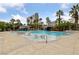 Resort style pool with waterfalls, lounge chairs, and lush tropical landscaping at 222 Karen Ave # 1908, Las Vegas, NV 89109
