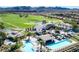 Stunning aerial view of community pools and golf course surrounded by lush landscaping at 30 Strada Di Villaggio # 118, Henderson, NV 89011