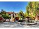 Courtyard with fountain, landscaping, and surrounding buildings at 30 Strada Di Villaggio # 118, Henderson, NV 89011