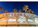 Illuminated entrance sign for Lake Las Vegas, showcasing its amenities and dining options at 30 Strada Di Villaggio # 118, Henderson, NV 89011