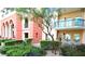 Exterior view of a multi-story condo featuring landscaped courtyard at 30 Strada Di Villaggio # 118, Henderson, NV 89011
