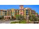 Attractive condo building with a landscaped entrance and covered parking at 30 Strada Di Villaggio # 118, Henderson, NV 89011