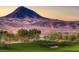 Expansive golf course view with sand traps and mountain backdrop on a sunny day at 30 Strada Di Villaggio # 118, Henderson, NV 89011