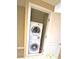 Bright laundry closet featuring a stacked washer and dryer at 30 Strada Di Villaggio # 118, Henderson, NV 89011