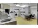 On-site laundry facility with multiple washers, dryers, and folding tables at 30 Strada Di Villaggio # 118, Henderson, NV 89011
