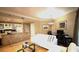 Open-concept living room and kitchen with granite countertops and stainless steel appliances at 30 Strada Di Villaggio # 118, Henderson, NV 89011