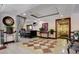 The common lobby has tile flooring, comfortable seating, and a decorative bar area at 30 Strada Di Villaggio # 118, Henderson, NV 89011