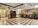 This lobby features elegant tile flooring, comfortable seating, and stylish decor at 30 Strada Di Villaggio # 118, Henderson, NV 89011