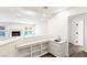 Modern bar area includes ample storage, a sink, and a cozy fireplace, great for entertaining at 3021 Ocean Port Dr, Las Vegas, NV 89117