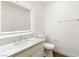 Chic half bath with a lighted mirror, gold fixtures, and a modern vanity at 3021 Ocean Port Dr, Las Vegas, NV 89117