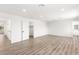 Bright bedroom with wood floors and access to both the bathroom and closet at 3021 Ocean Port Dr, Las Vegas, NV 89117