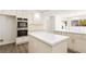 Well-equipped kitchen with stainless steel appliances, a large island, and ample cabinet space at 3021 Ocean Port Dr, Las Vegas, NV 89117