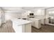 Modern kitchen features a spacious island, stainless steel appliances, and ample counter space at 3021 Ocean Port Dr, Las Vegas, NV 89117