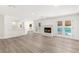 Bright living room with fireplace and open access to the kitchen and backyard at 3021 Ocean Port Dr, Las Vegas, NV 89117