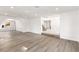 Open-concept living room showcases hardwood floors, an archway and staircase at 3021 Ocean Port Dr, Las Vegas, NV 89117